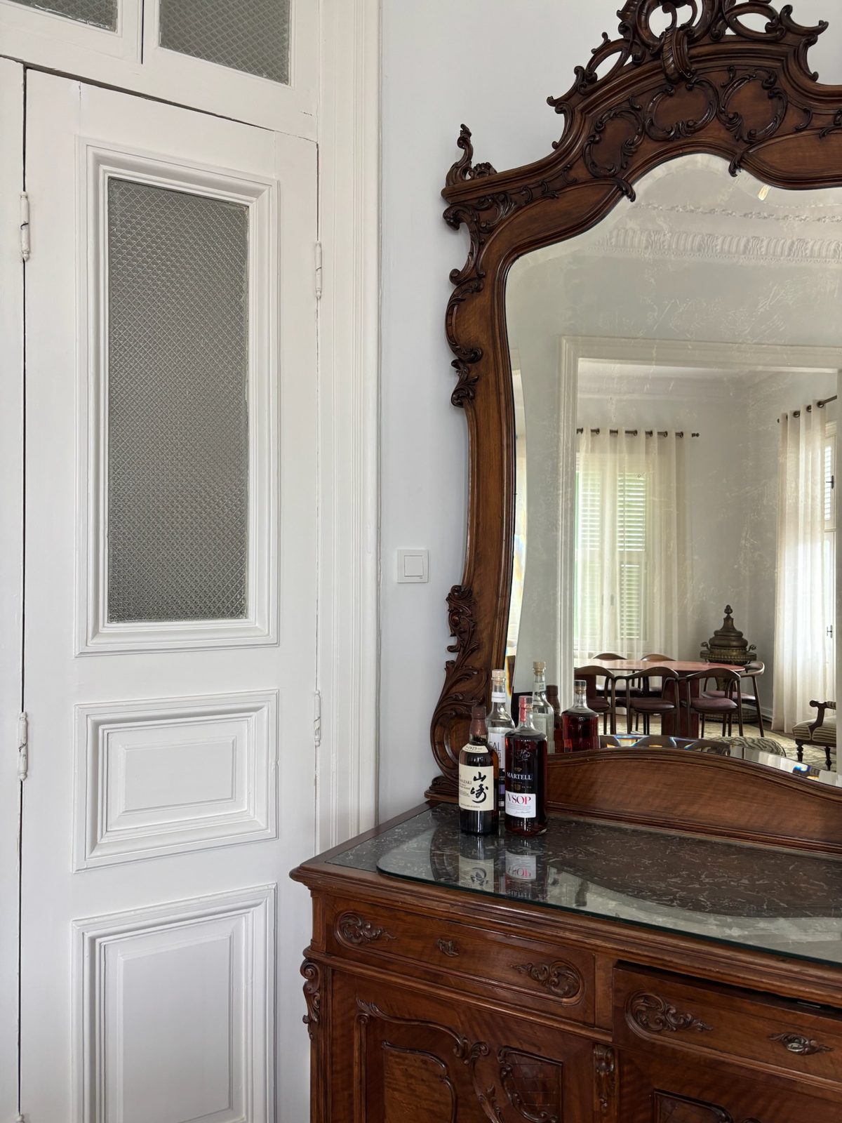 Carved mirror and bar