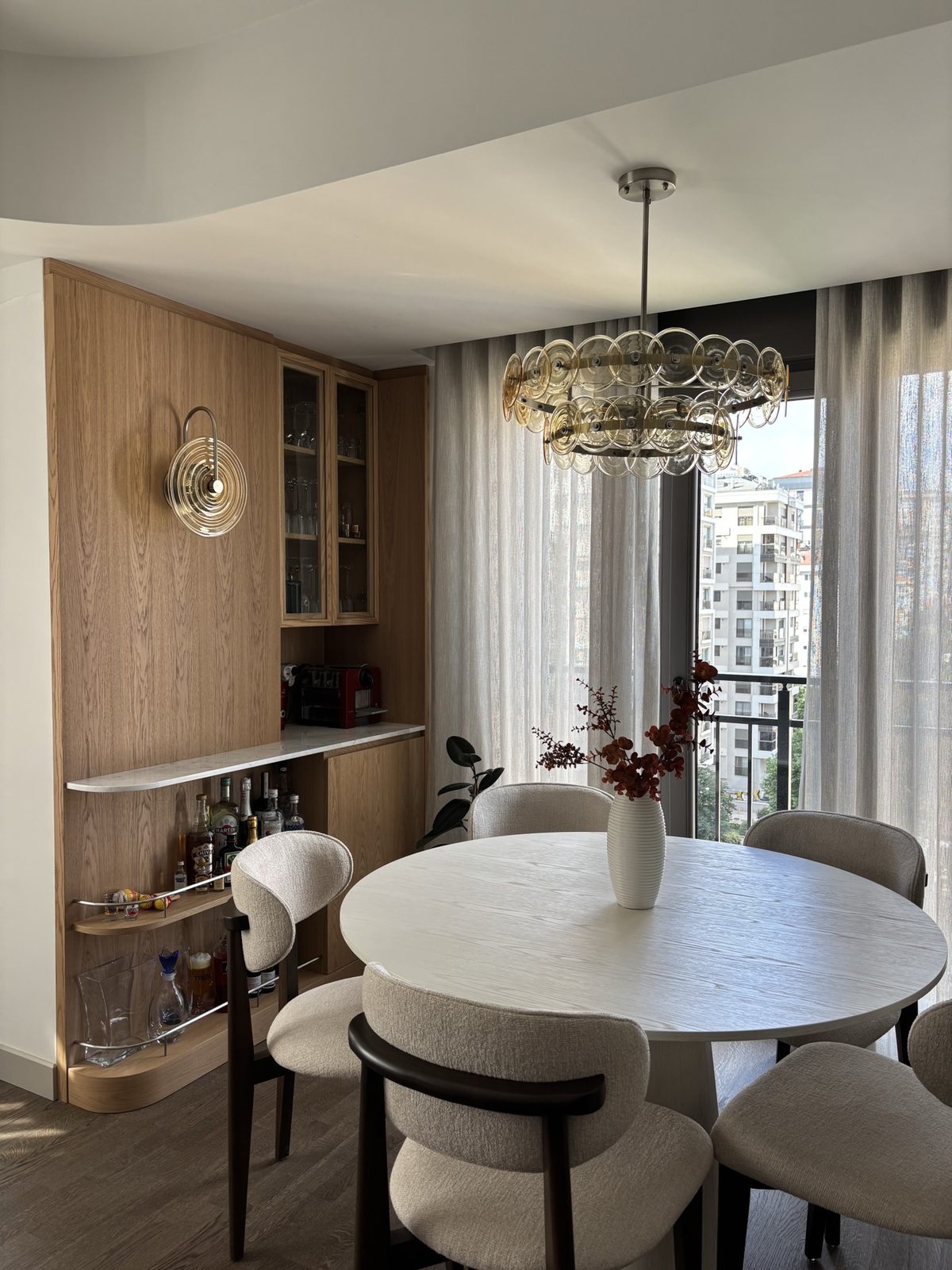 Round dining table beside the built-in bar