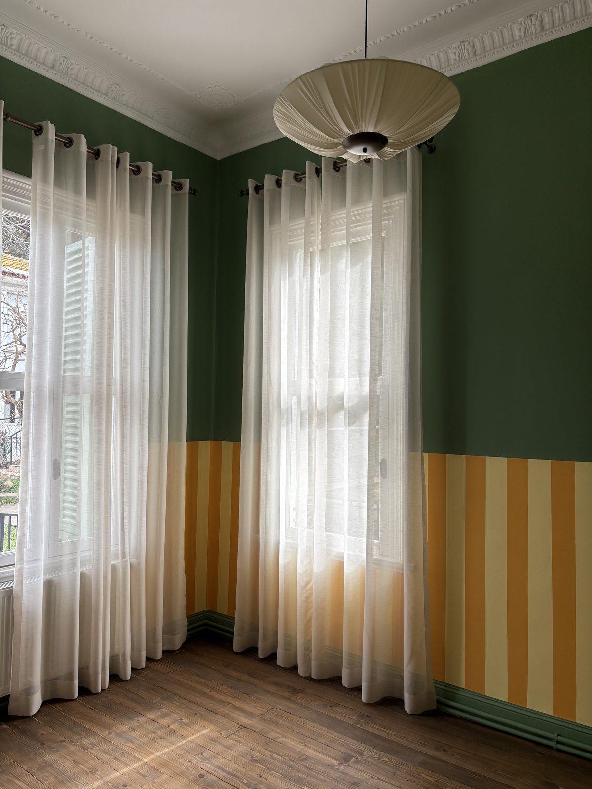 Glass pendant against tiled corner