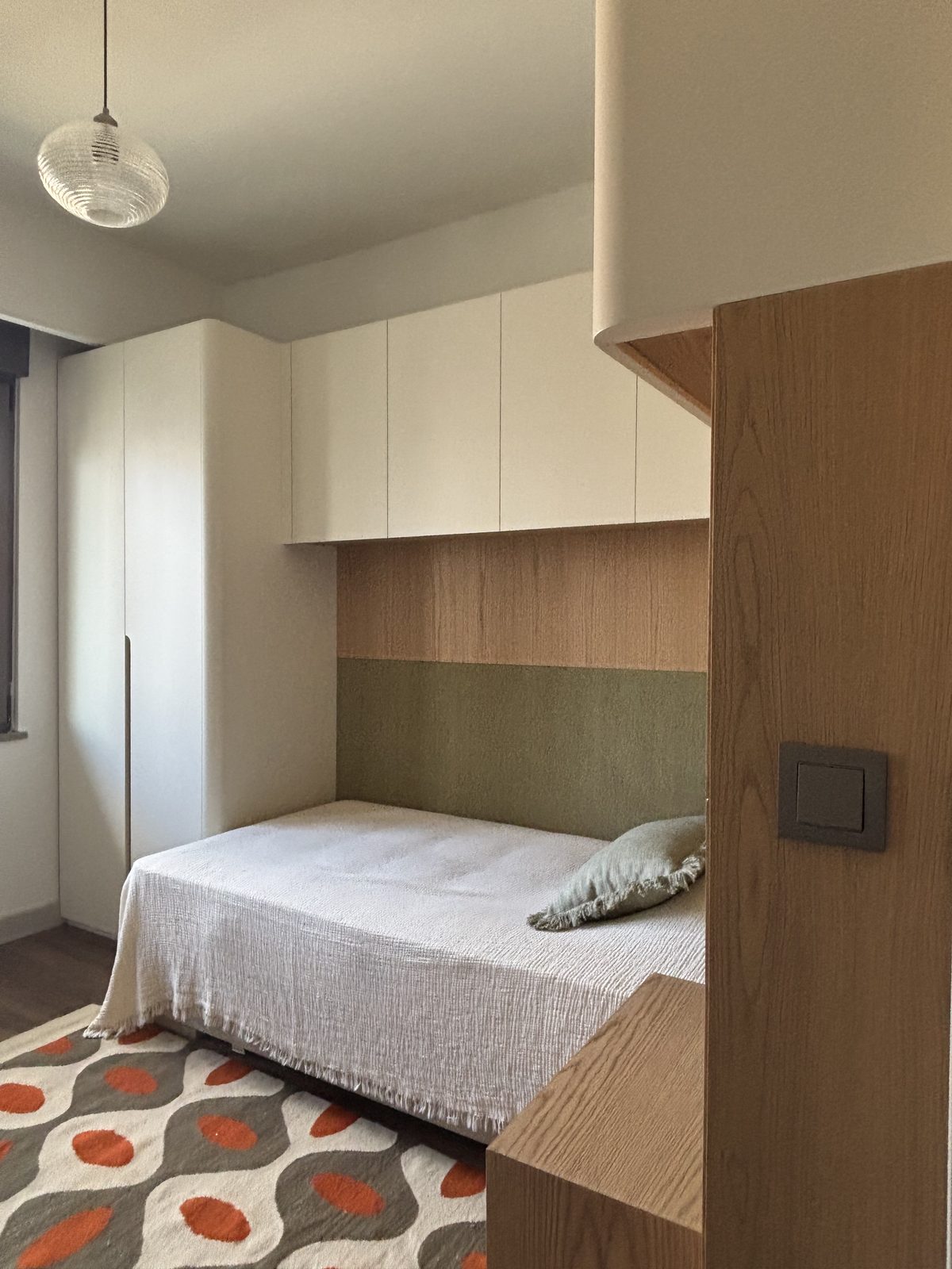 Guest bedroom with full-height oak wardrobes