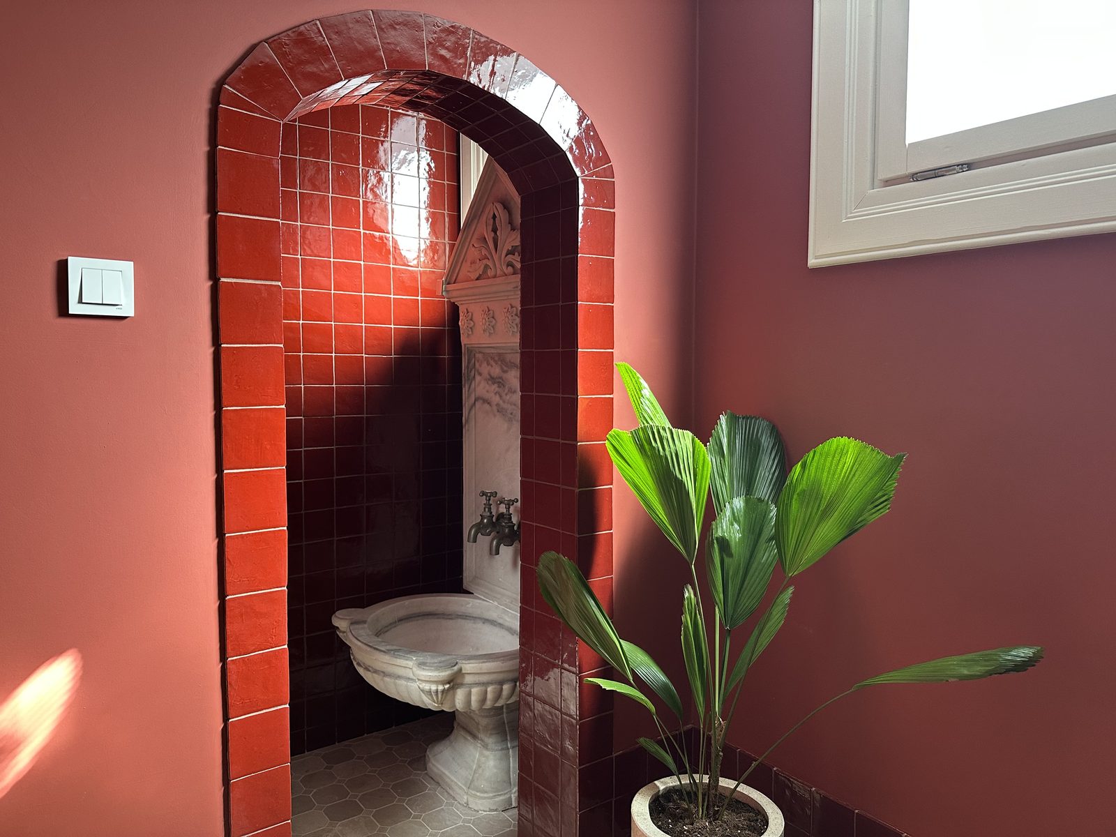 Red arched niche